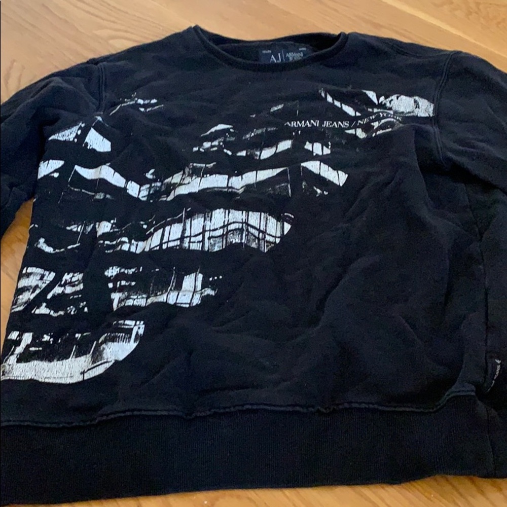 A black and white Armani jeans sweater